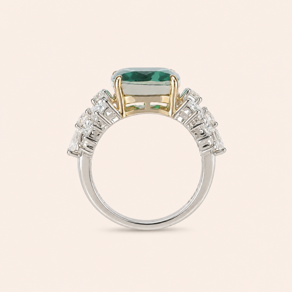 Radiating elegance and timeless charm, the Elegant Green Stone Ring features a captivating green center stone surrounded by a halo of sparkling lab-grown diamonds. Designed to make a statement, this sophisticated piece combines vibrant color, exceptional brilliance, and refined craftsmanship, making it perfect for special occasions or adding a touch of luxury to everyday style.