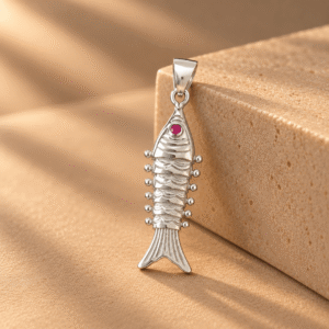 Silver fish pendant with pink stone and detailed tail design